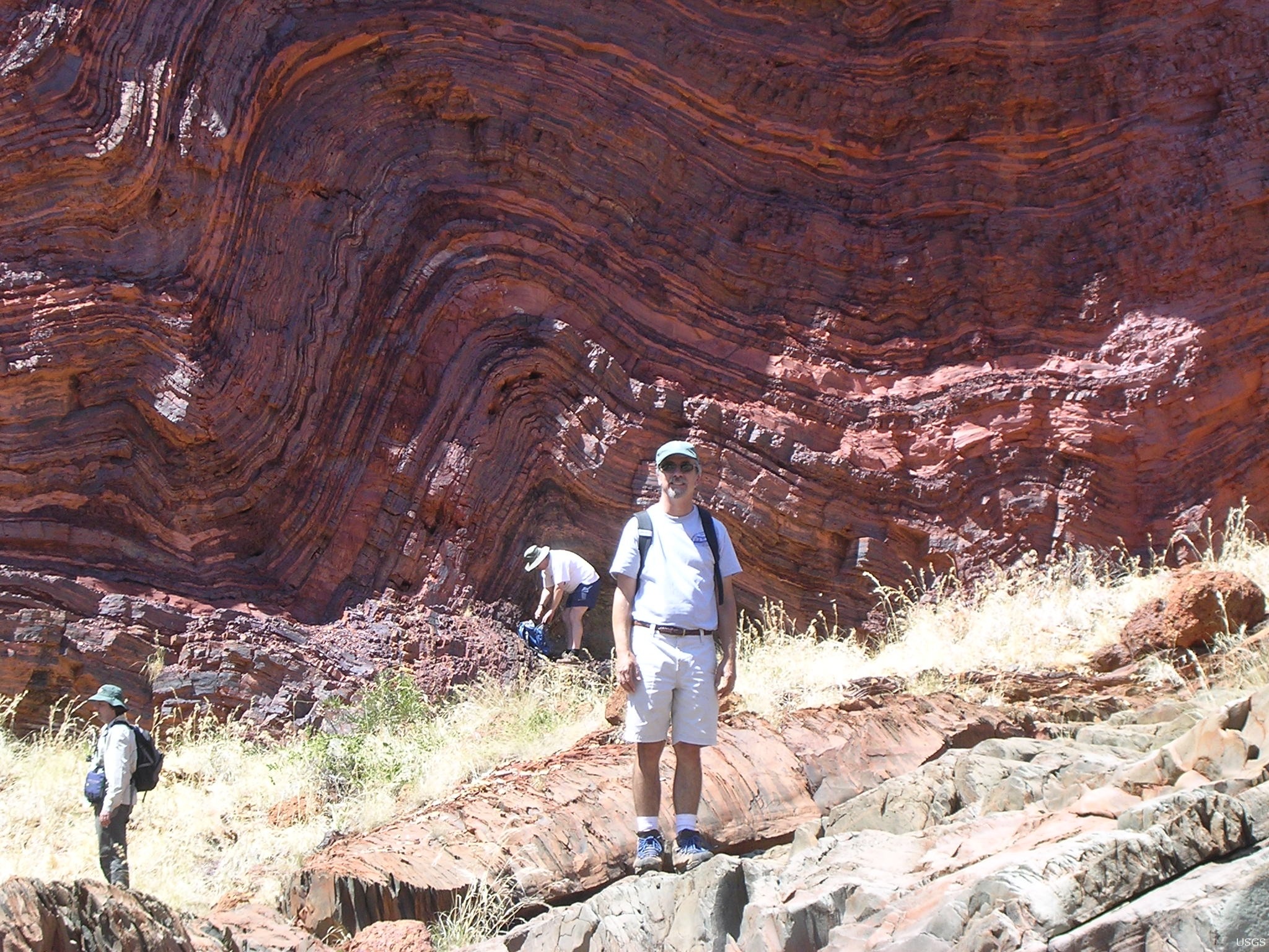 A wide, folded banded iron formation cliff face at Hamersley Range, Western Australia